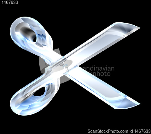 Image of Scissor in transparent glass on black background 