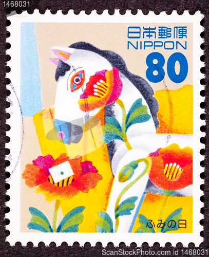 Image of Canceled Japanese Postage Stamp Tulip Flower Covered Hobby Horse