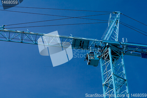 Image of Construction Crane Isolated Against Blue Sky 
