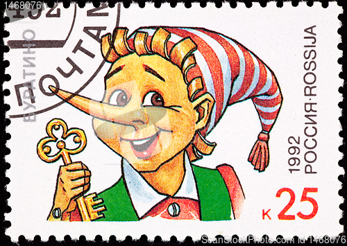 Image of Canceled Russian Postage Stamp Pinocchio Puppet Holding Gold Key