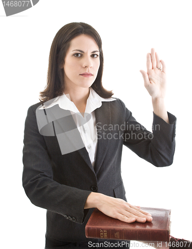 Image of Caucasian Woman Swearing on a Bible Isolated White Background