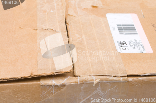 Image of Worn Top Cardboard Package Box US Metered Mail