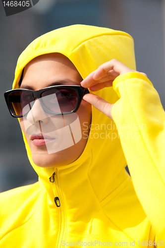 Image of girl in a yellow hood