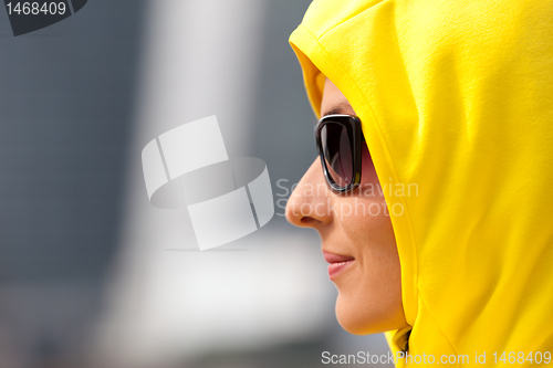 Image of girl in a yellow hood