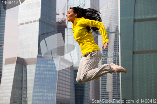 Image of brunette jumping