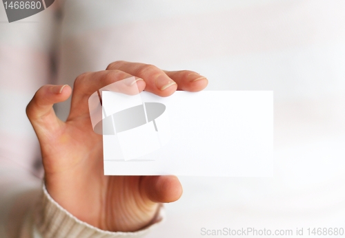 Image of hand and blank paper with copyspace