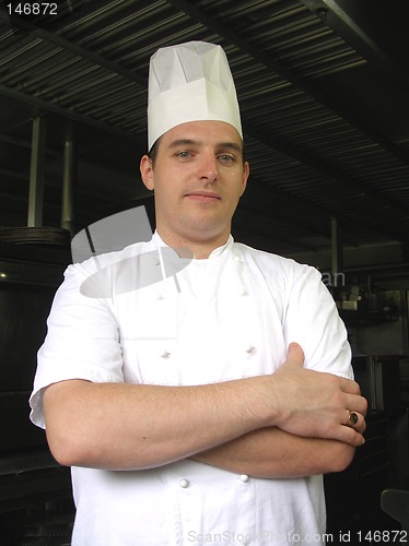 Image of Chef is posing for the camera