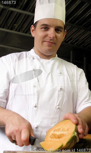 Image of Chef is slicing a melon