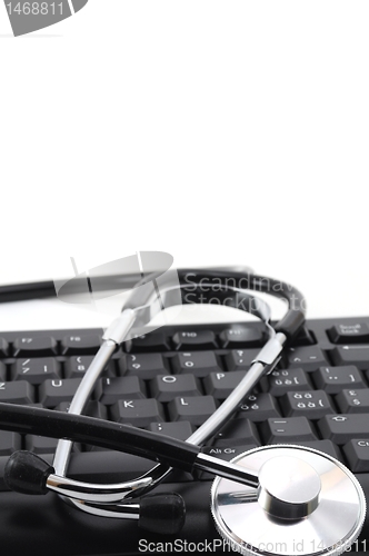 Image of stethoscope on computer keyboard