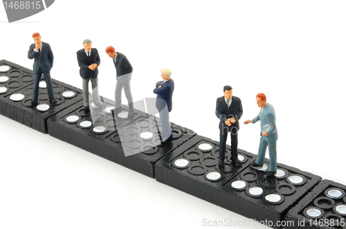 Image of business man on domino 