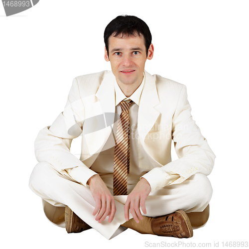 Image of Business man sitting on a white