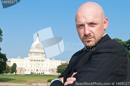 Image of Powerful Caucasian Man Suit Arms Crossed US