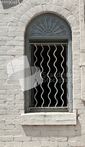 Image of Window with Decorative Bars and Sunrise