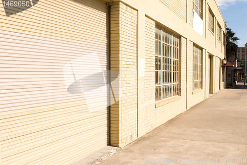 Image of Warehouse Door and Loading Dock, Beige Brick