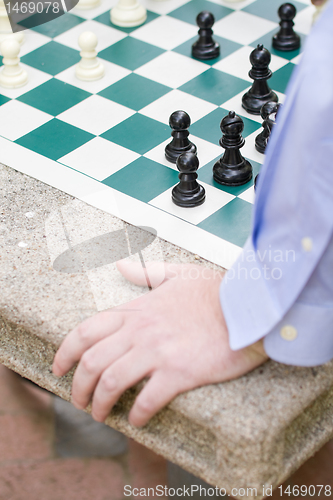 Image of Hand, Chess Game, Board, Pieces, Table