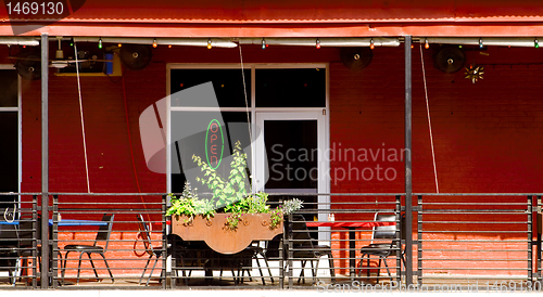 Image of Porch of Southwestern Style Restaurant in Primary Colors, Roof, 