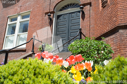 Image of Brick Richardsonian Romanesque Row Home Spring
