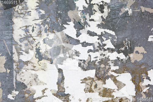 Image of XXXL Full Frame Grungy Metal Surface Covered Torn Poster Scraps