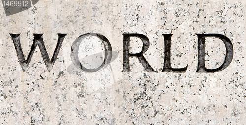 Image of Word "World" Carved in Gray Granite Stone        