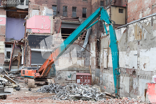 Image of Demolition Equipment Knocking Down Building Collecting Scrap Met