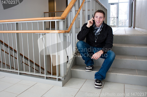 Image of Man Talking on His Cell Phone in the Stairwell