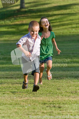 Image of Two Young Children Running and Playing