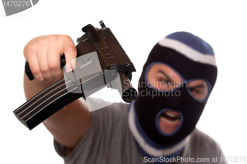Image of Terrorist Pointing an Automatic Weapon