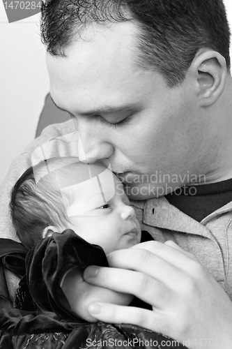 Image of Happy Daddy Kissing His Baby Daughter