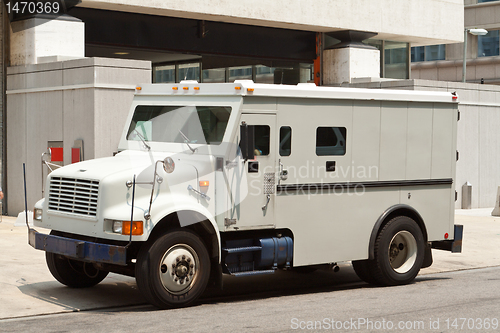 Image of Armoured Armored Car Parked on Street Building