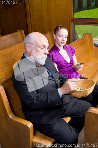 Image of Senior White Man Young Woman Donating Money Church