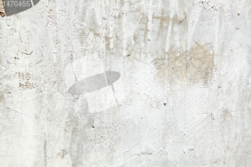 Image of Full Frame Grungy Dirty Painted Cement Wall with Dripping Paint