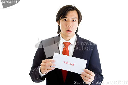 Image of Shocked Asian Man Suit Holding Foreclosure Notice