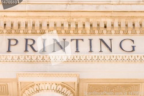 Image of Word "Printing" on the Side of a Building Facade