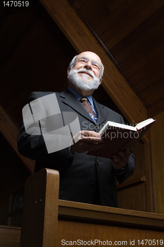 Image of Senior Caucasian Man Standing Church Pew Hymnal