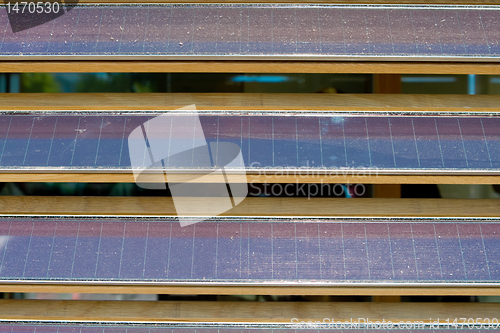 Image of Row of Dusty Louvered Solar Panels