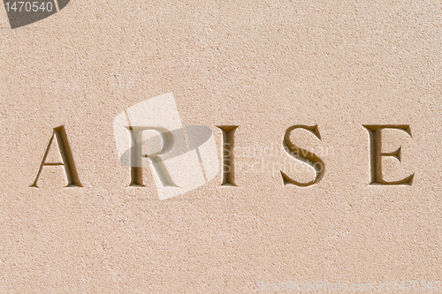 Image of Word "Arise" Carved in Sandstone Stone