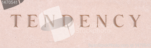 Image of Word "Tendency" Carved in Sandstone Stone