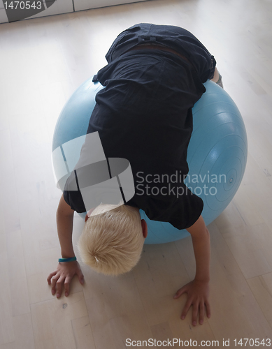 Image of Teen on pilates ball
