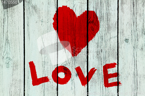 Image of love symbol on old wooden wall