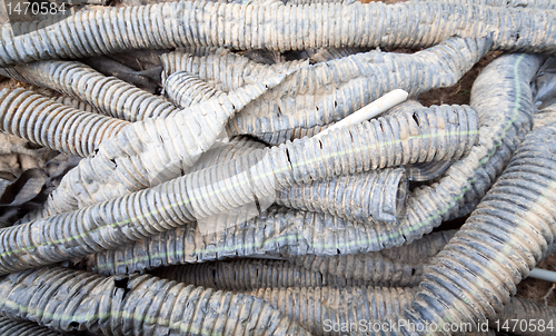 Image of Big Pile of Dirty Plastic Drainage Tubes Wide Angle