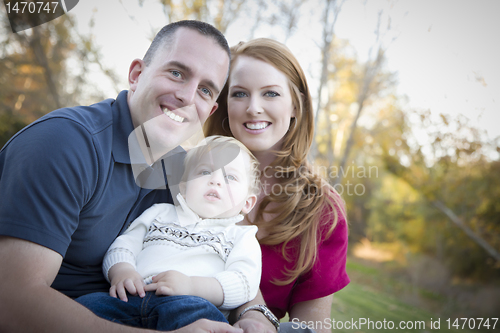 Image of Young Attractive Parents and Child Portrait Outside
