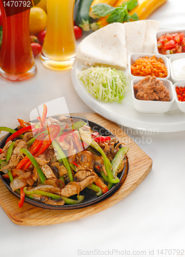 Image of original fajita sizzling hot  on iron plate