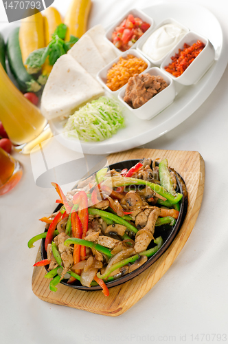 Image of original fajita sizzling hot  on iron plate