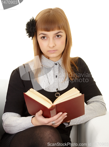 Image of Young woman reads a book