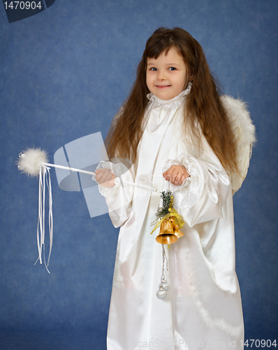 Image of Child dressed as an angel with a magic wand
