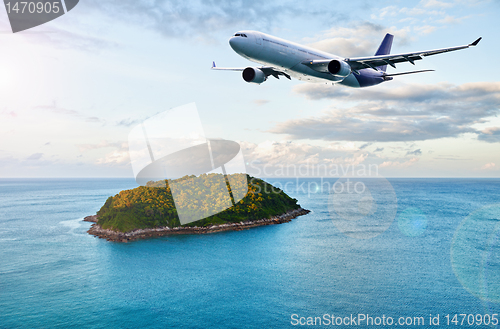 Image of Passenger plane over tropical island