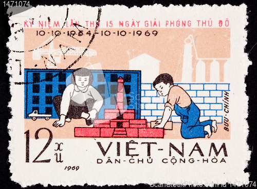 Image of Canceled North Vietnamese Postage Stamp Children Playing Buildin