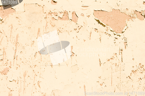 Image of Weathered Paint Peeling Flaking Off Adobe Wall