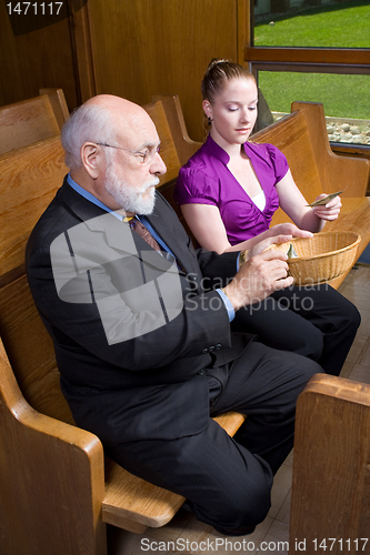 Image of Older White Man Young Woman Donating Money Church Offering Baske