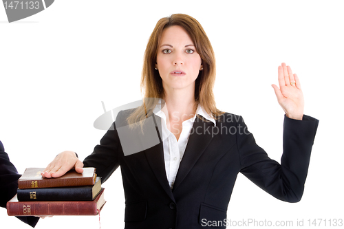 Image of Caucasian Woman Swearing on a Stack of Bibles White Background